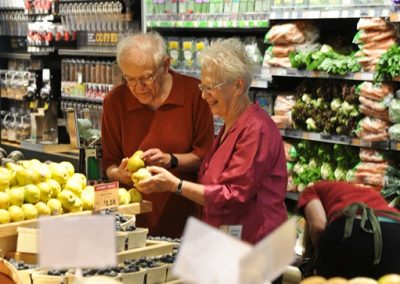 seniors shopping for groceries together
